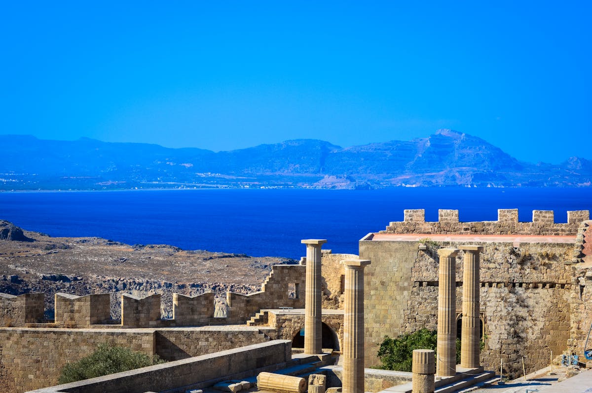 Ancient Greek ruins with sea view in background