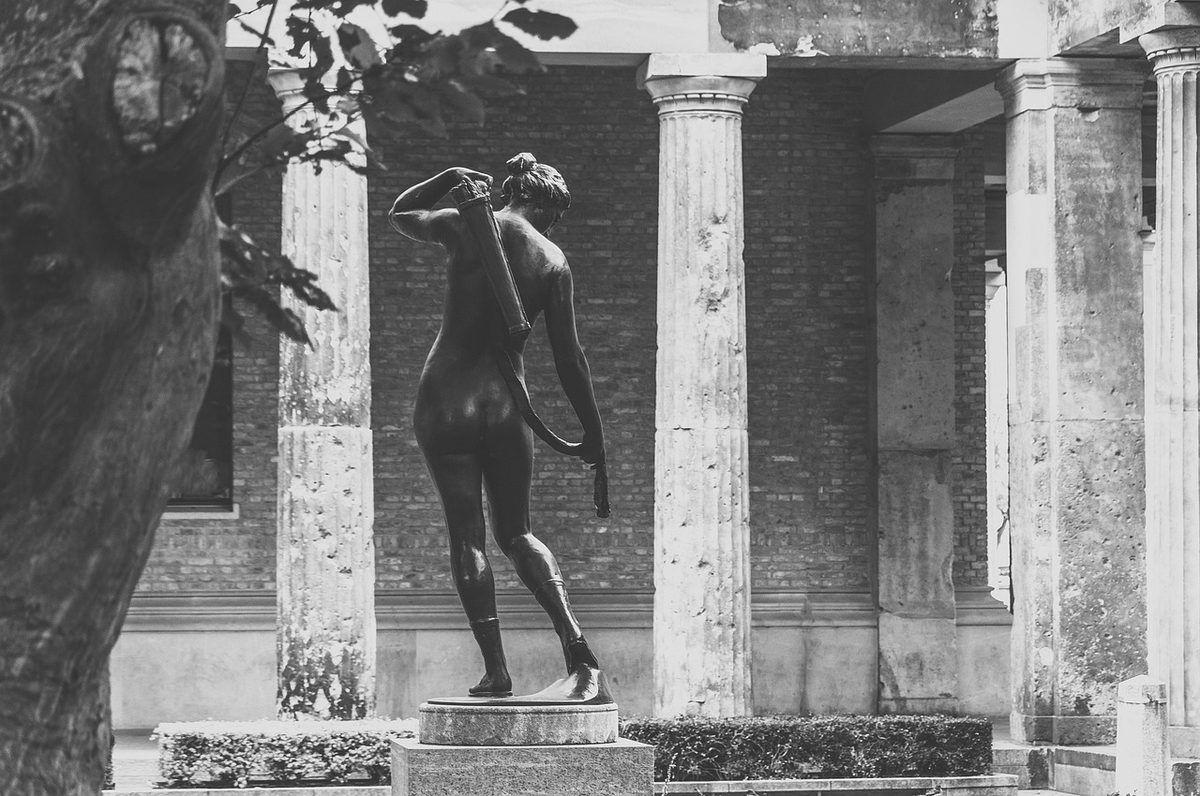 Greek sculptures in a museum gallery