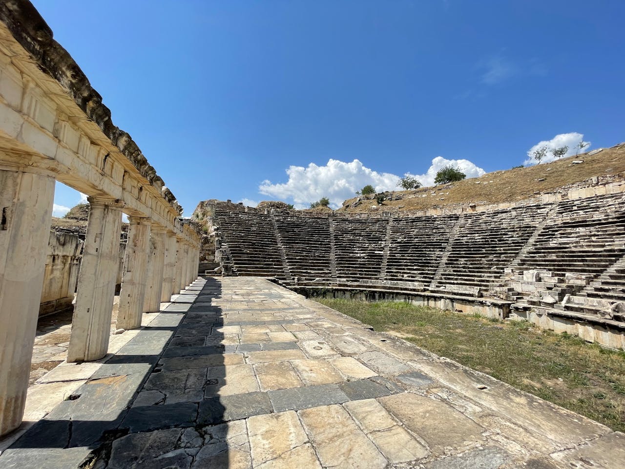 Stone amphitheatre with curved rows of seating in Greece