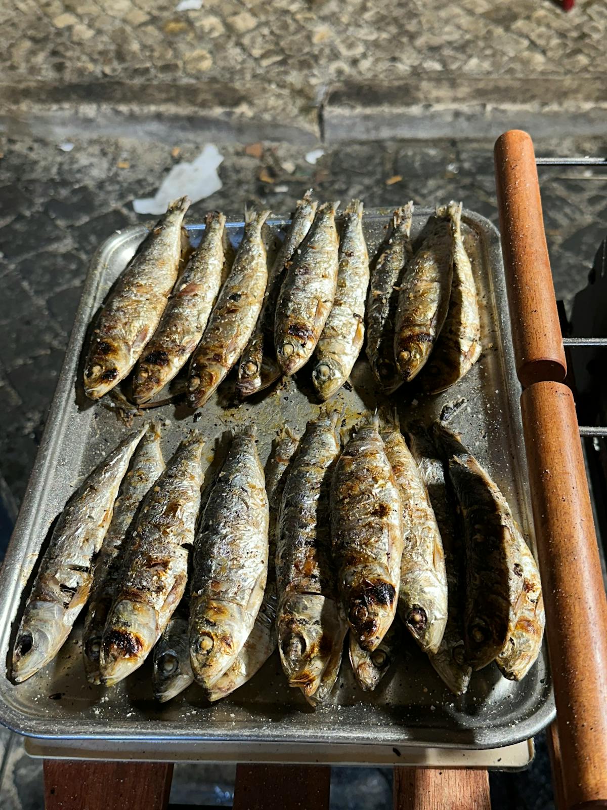 Freshly grilled sardines at a Lisbon street stall