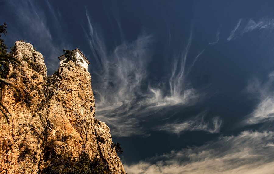 Guadalest bell tower with mountain backdrop in Alicante province