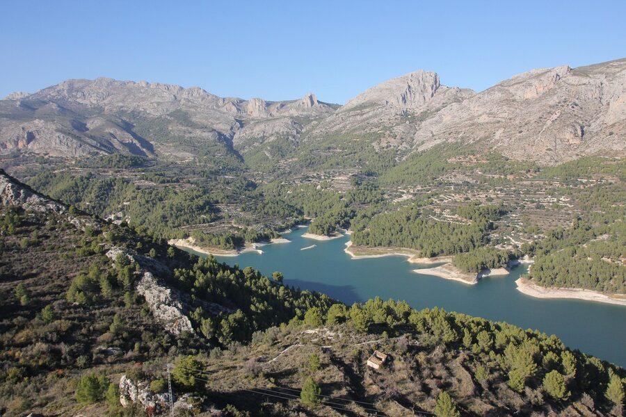Guadalest lake surrounded by mountains and green landscape