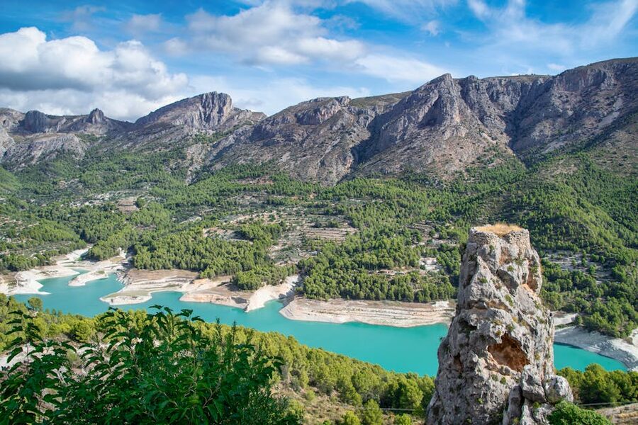 Guadalest Valley with turquoise reservoir and rugged mountains