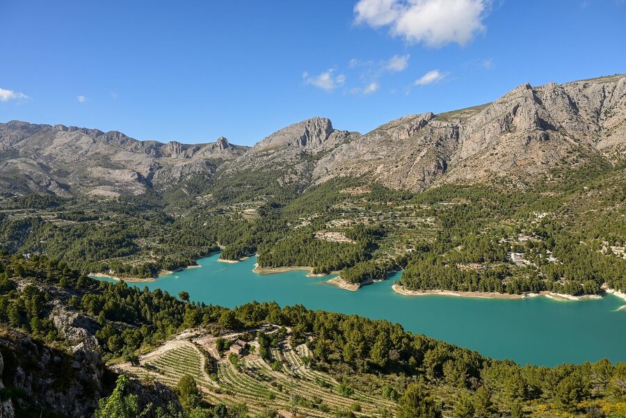 Guadalest water reservoir with mountains in the background