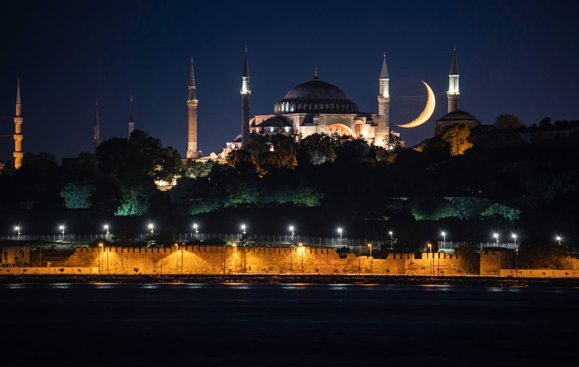 Hagia Sophia Grand Mosque illuminated at night with a crescent moon