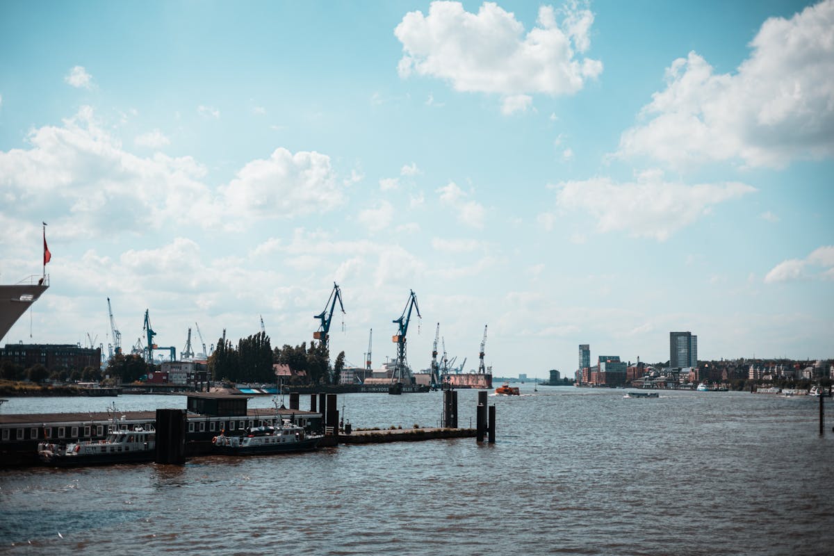 Hamburg harbor with boats and the Elbphilharmonie in the background
