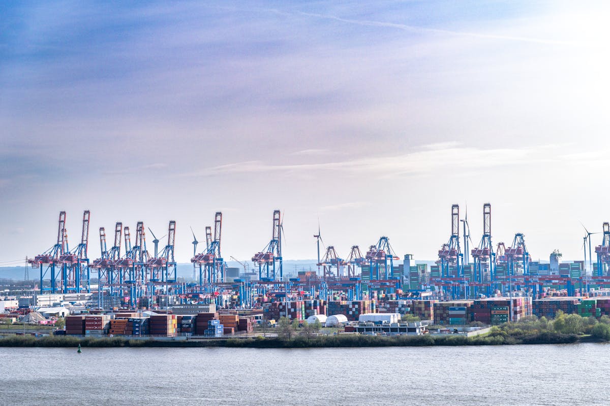 Hamburg harbor illuminated at night with reflections on water