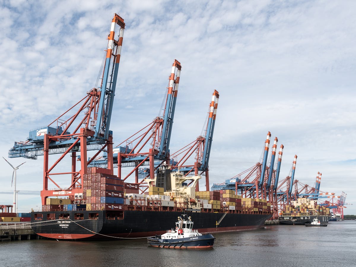 Reflections of harbor lights on the Elbe river at night