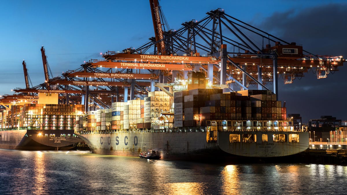 Wine glass on a table with Hamburg harbor view