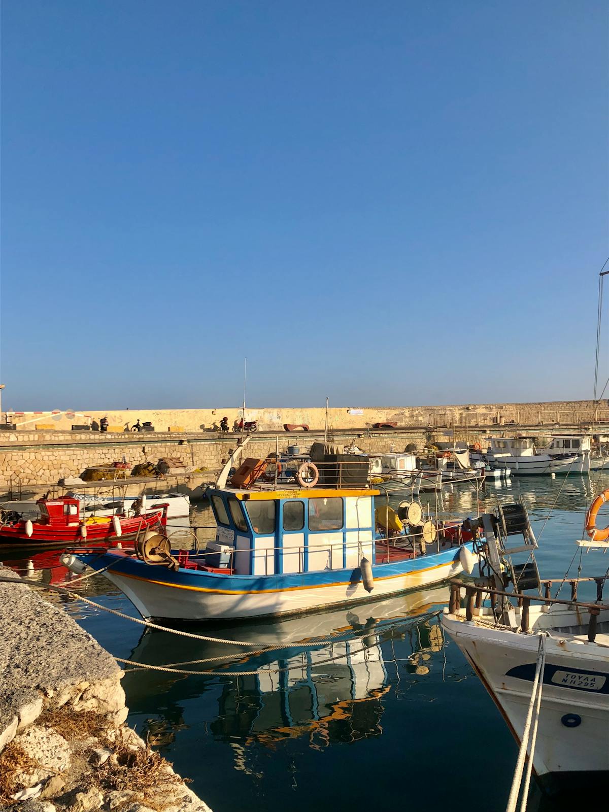 Historic Heraklion harbor with fishing boats