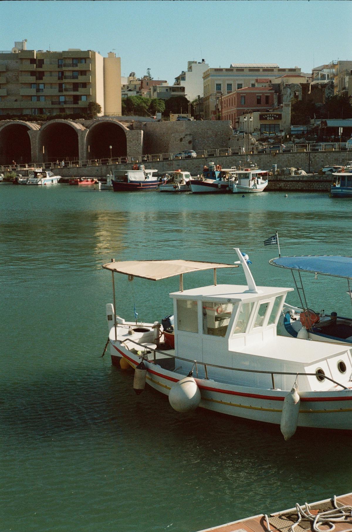 Heraklion harbor with historic architecture, sunny day