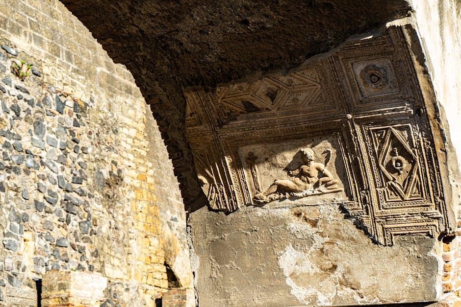 Carved stone relief showing detailed Roman artistry at the Herculaneum ruins