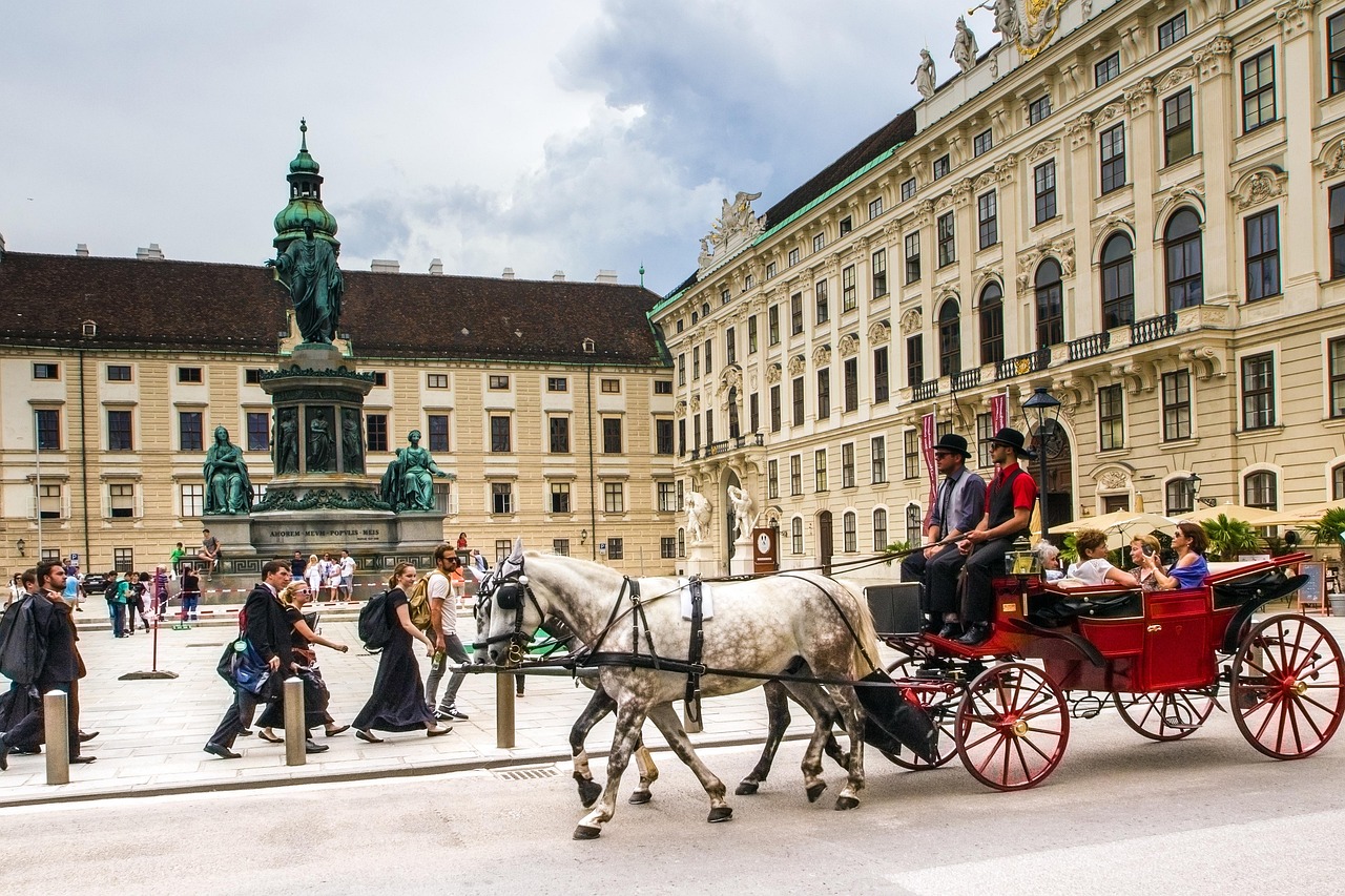 Traditional Fiaker horse carriage in front of the Hofburg Imperial Palace in Vienna