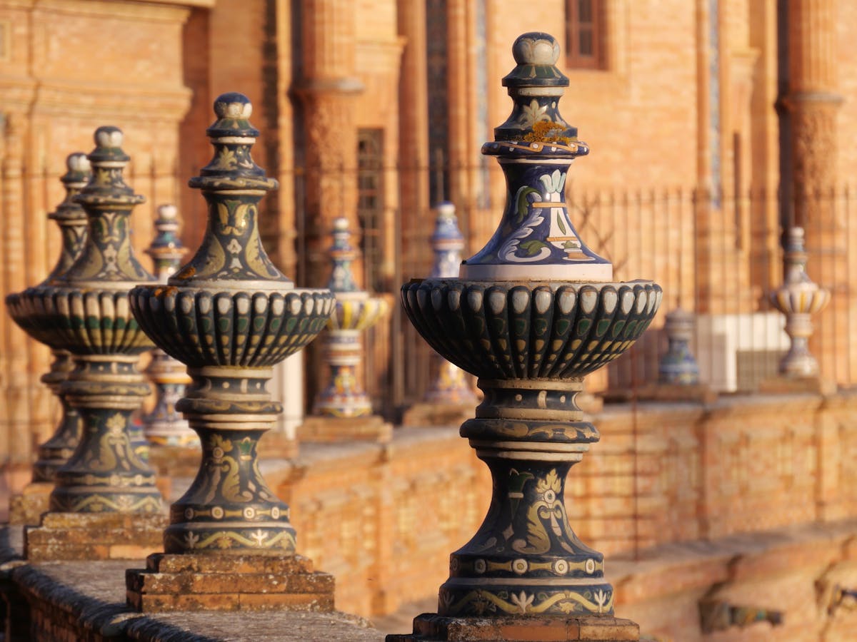 Ceramic balustrades at Plaza de Espana in Seville during golden hour with warm sunset light