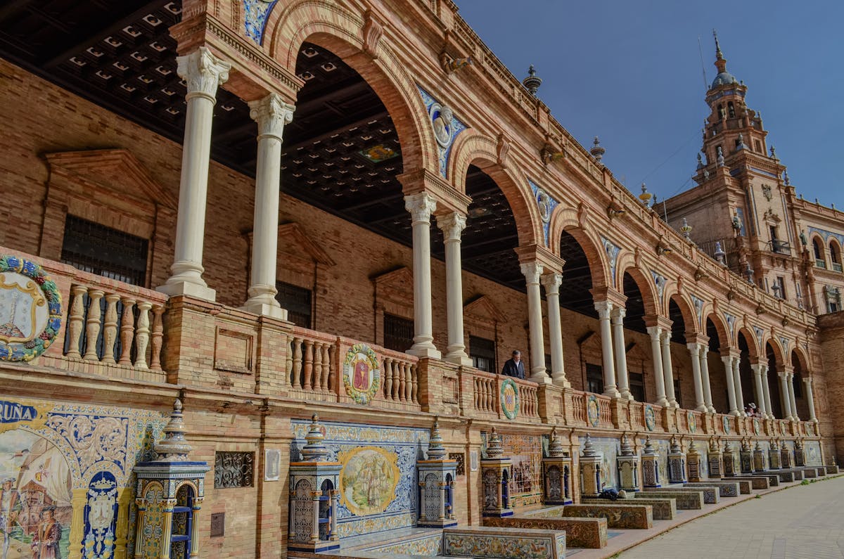 The Plaza de Espana in Seville Spain with its grand semicircular architecture and ornate bridges