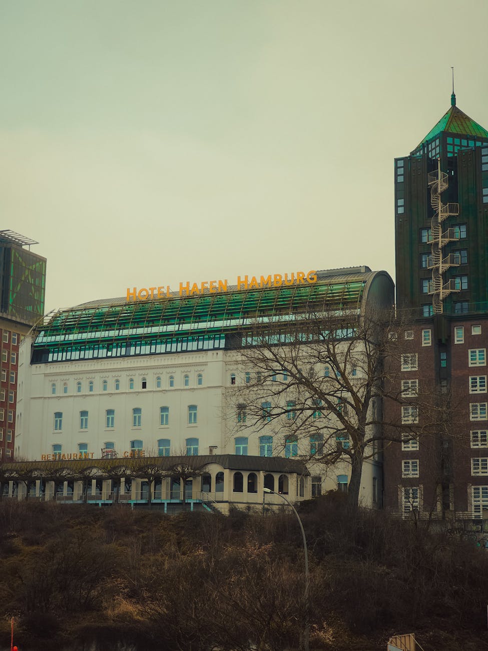 Hotel Hafen Hamburg landmark building against overcast sky