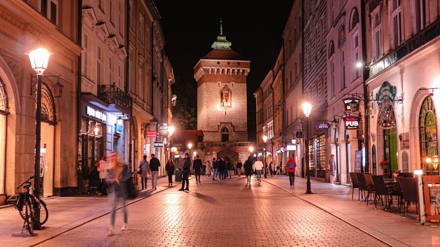 St Florian Gate Krakow at night with pedestrians