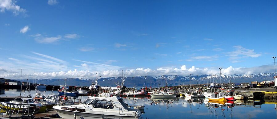 Húsavík harbour Iceland with traditional whale watching ships