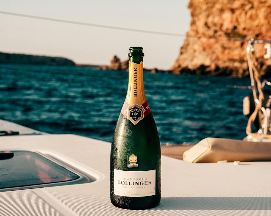 Bollinger champagne bottle on a yacht with Ibiza ocean view in background
