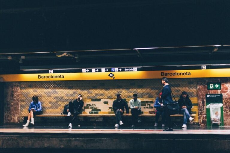 Barceloneta Metro station with commuters on the platform