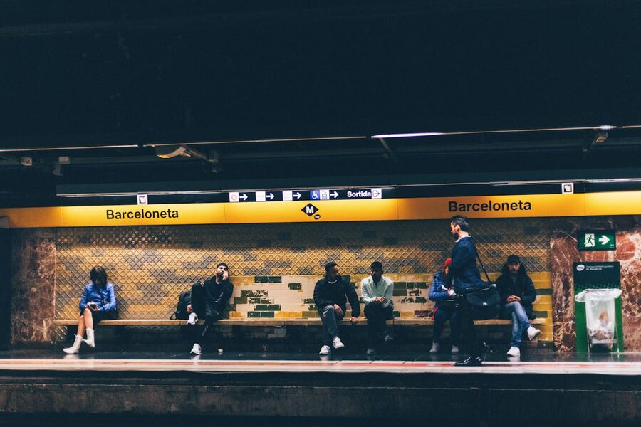 Barceloneta Metro station with commuters on the platform