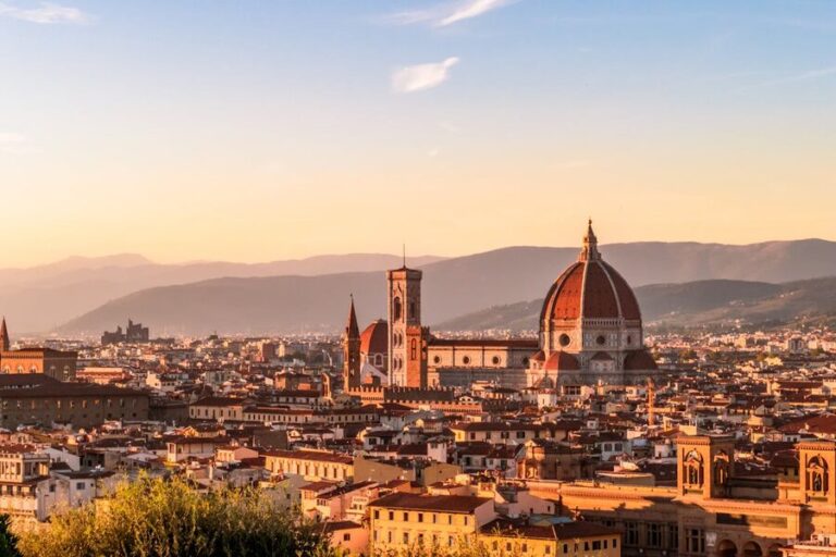 Panoramic sunset view of Florence Italy showing the Duomo cathedral and city rooftops