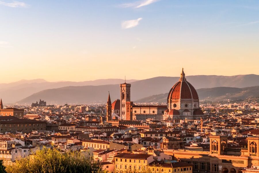 Panoramic sunset view of Florence Italy showing the Duomo cathedral and city rooftops