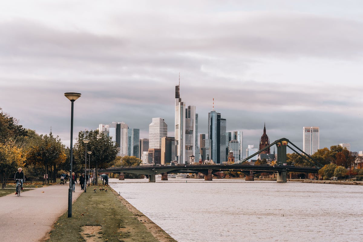The Main River flowing through central Frankfurt with bridges in the distance