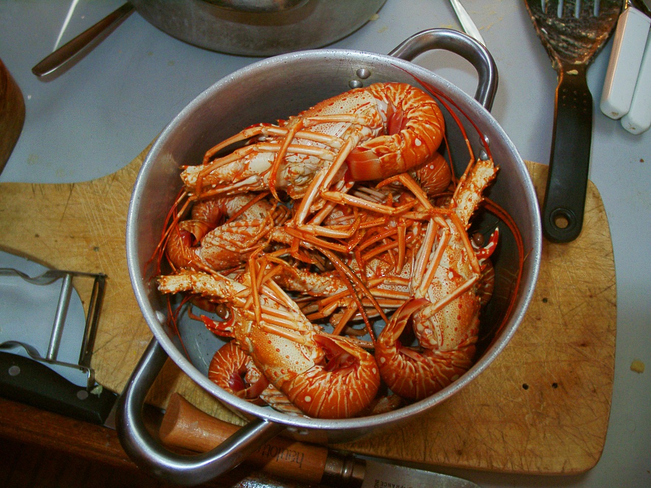 Seafood dish being prepared in a cooking class setting