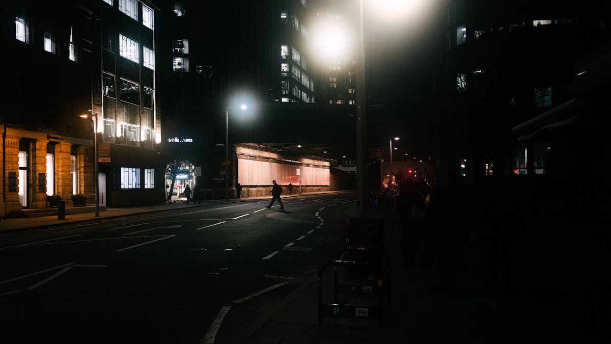 A moody evening view of a lit street in central London