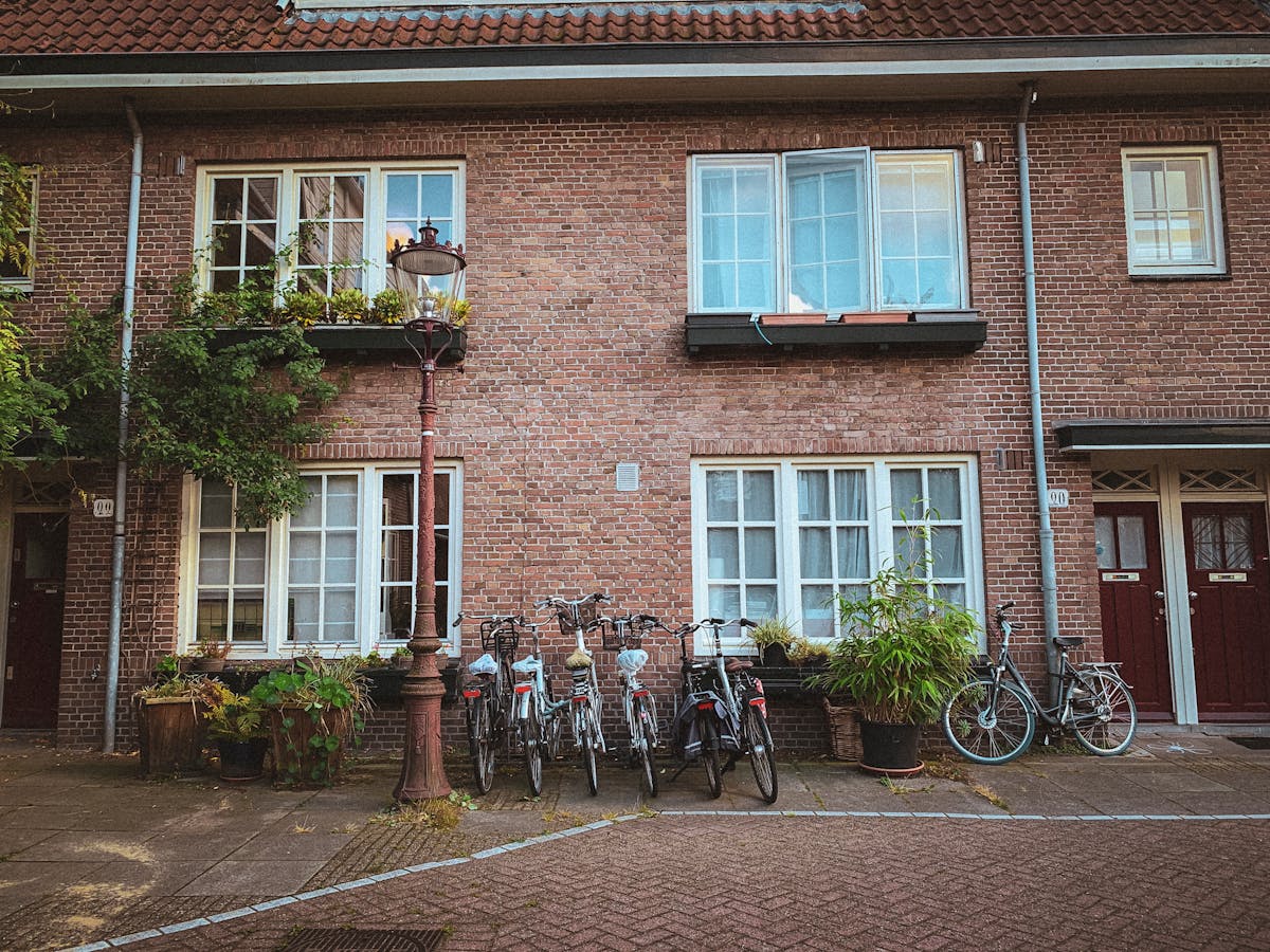 Scenic Amsterdam street with traditional Dutch houses and parked bicycles