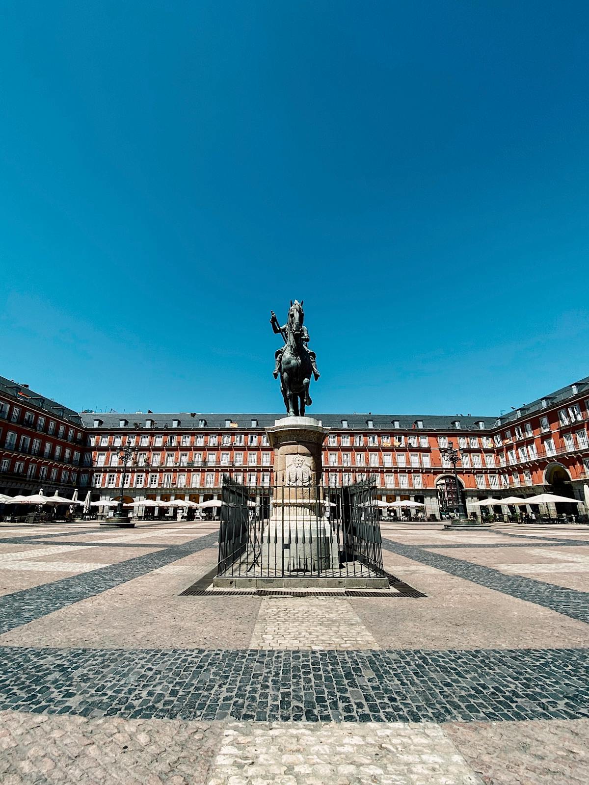 Plaza Mayor Madrid equestrian statue in sunlight