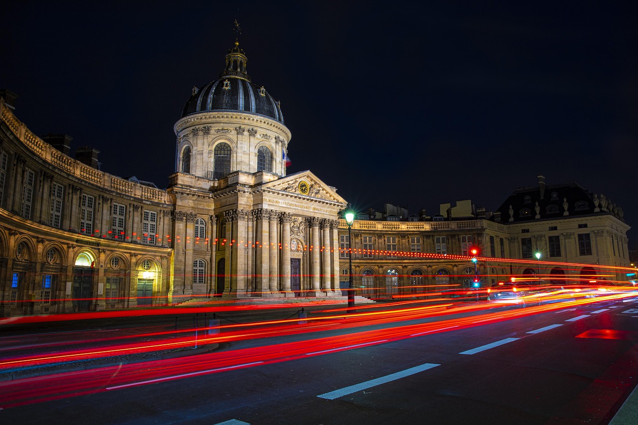 Seine River in Paris with historic buildings and bridges at night
