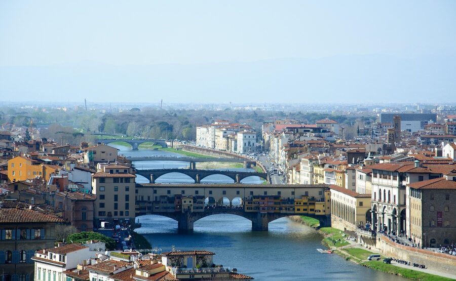 View along the Arno River in Florence showing historic buildings and bridges