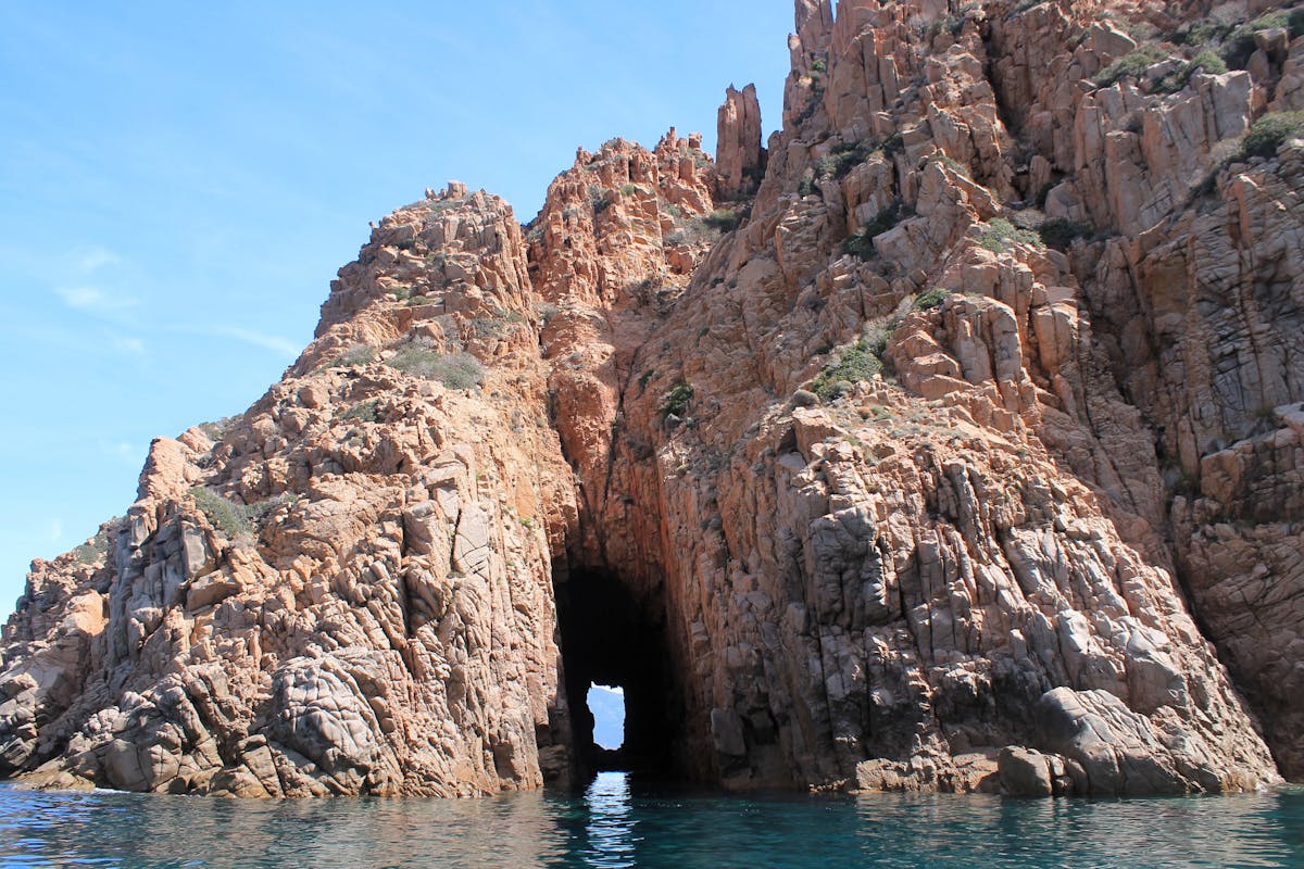 Rock formations and sea grotto on Corsica seashore