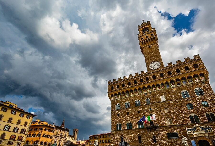 Palazzo Vecchio fortress-like tower and clock in Florence Piazza della Signoria