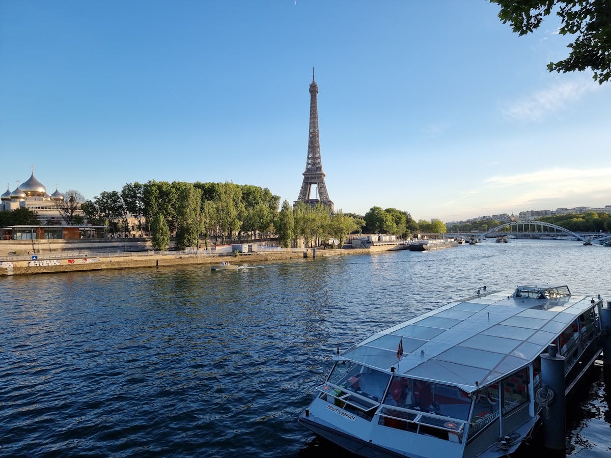 Scenic Paris riverside view with the Eiffel Tower and boats