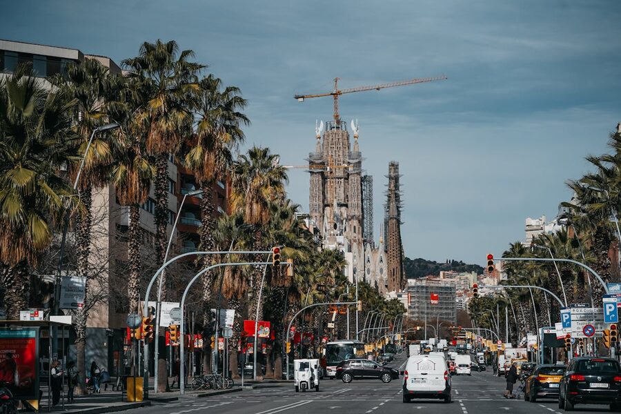 Street view in Barcelona with Sagrada Familia construction visible