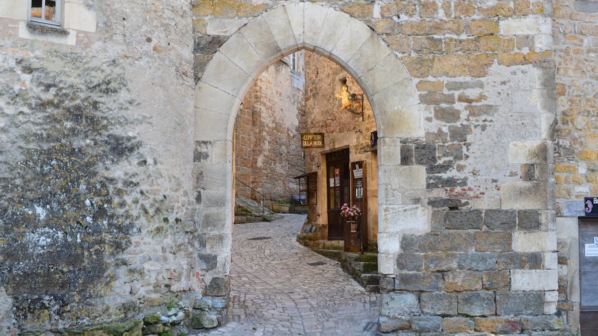 Stone alley with archway inside Carcassonne's medieval citadel