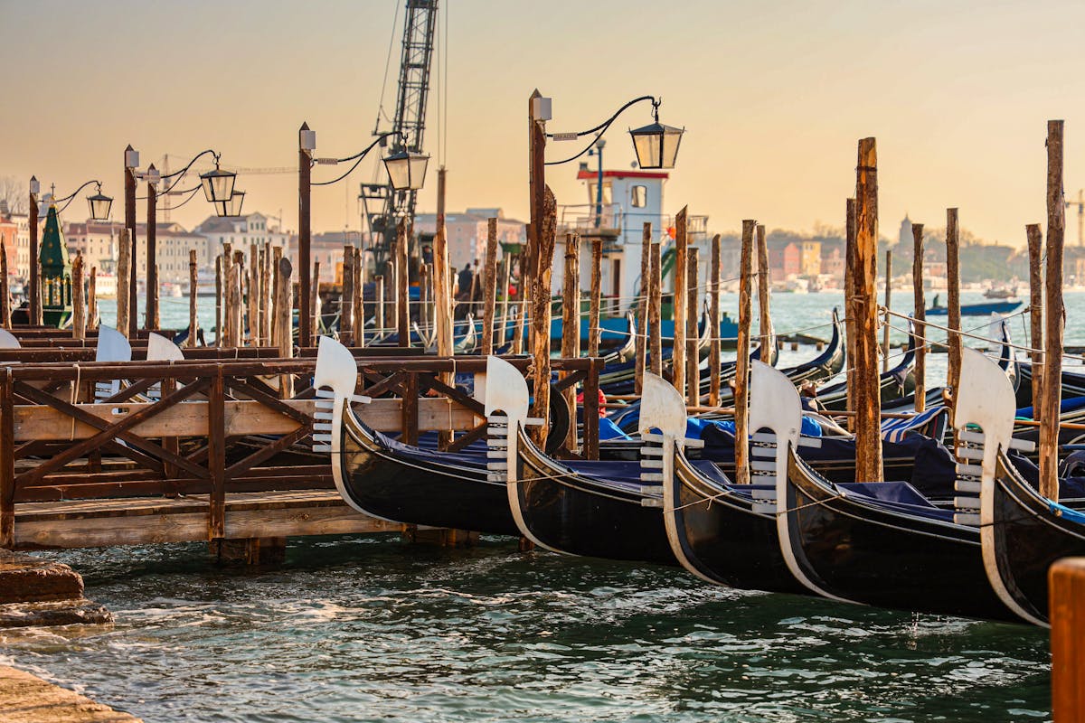 Gondolas moored at sunrise in Venice Italy