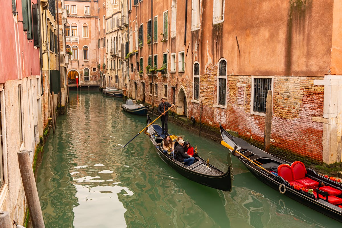Gondolas on a charming Venetian canal surrounded by historic architecture