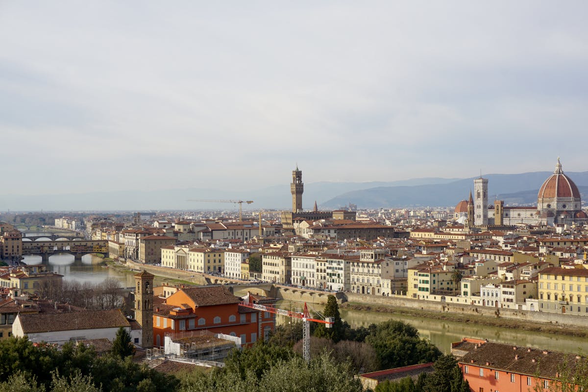 Elevated view of Florence Italy showing Ponte Vecchio bridge and Santa Maria del Fiore cathedral