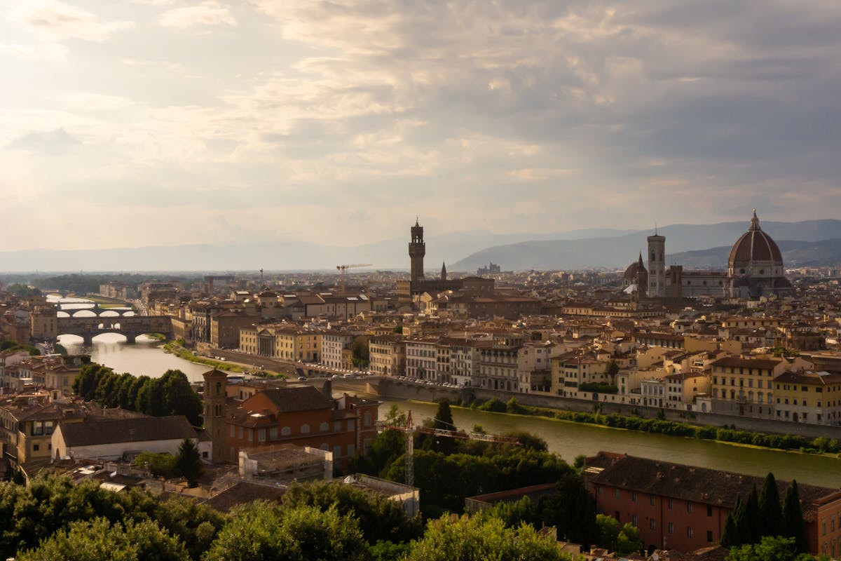 Florence skyline with Duomo and Arno River at sunset