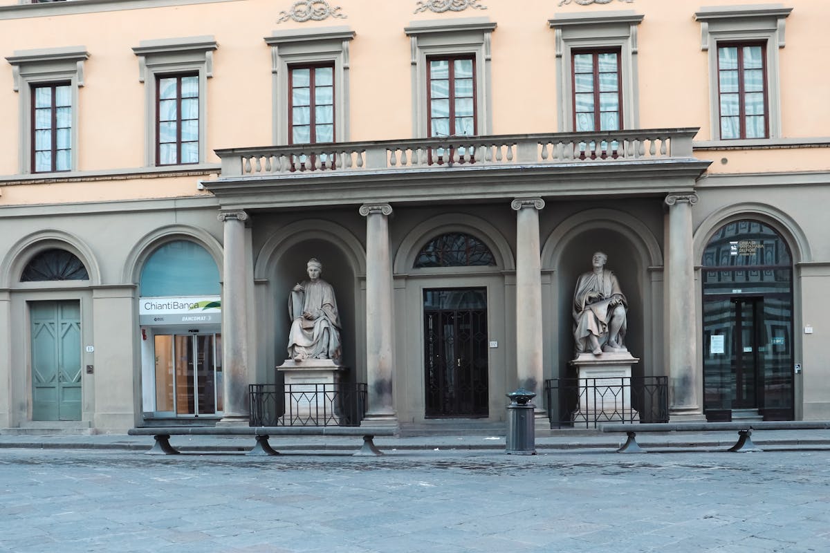 Facade with classic statues in Florence Tuscany showcasing Italian architectural elegance