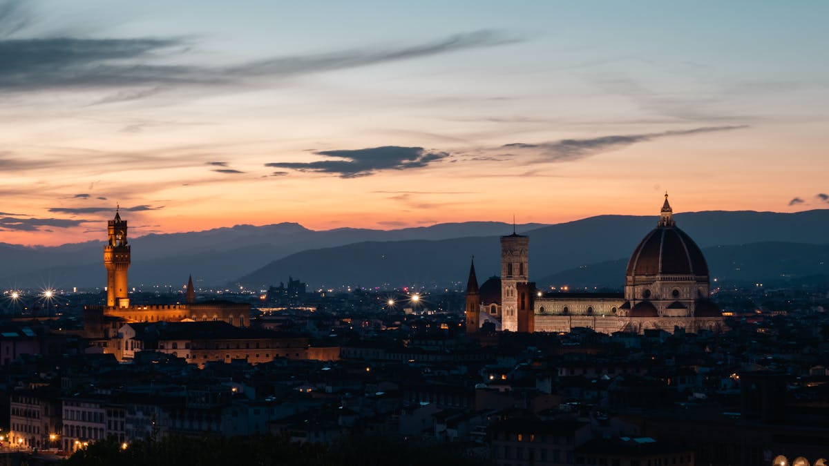 Sunset over Florence skyline featuring the Duomo and Palazzo Vecchio