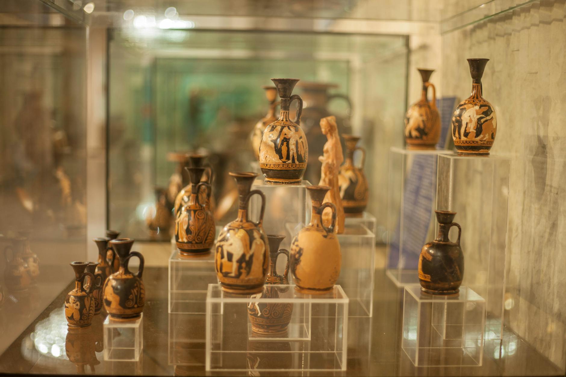 Ancient Greek pottery artifacts on display in a museum
