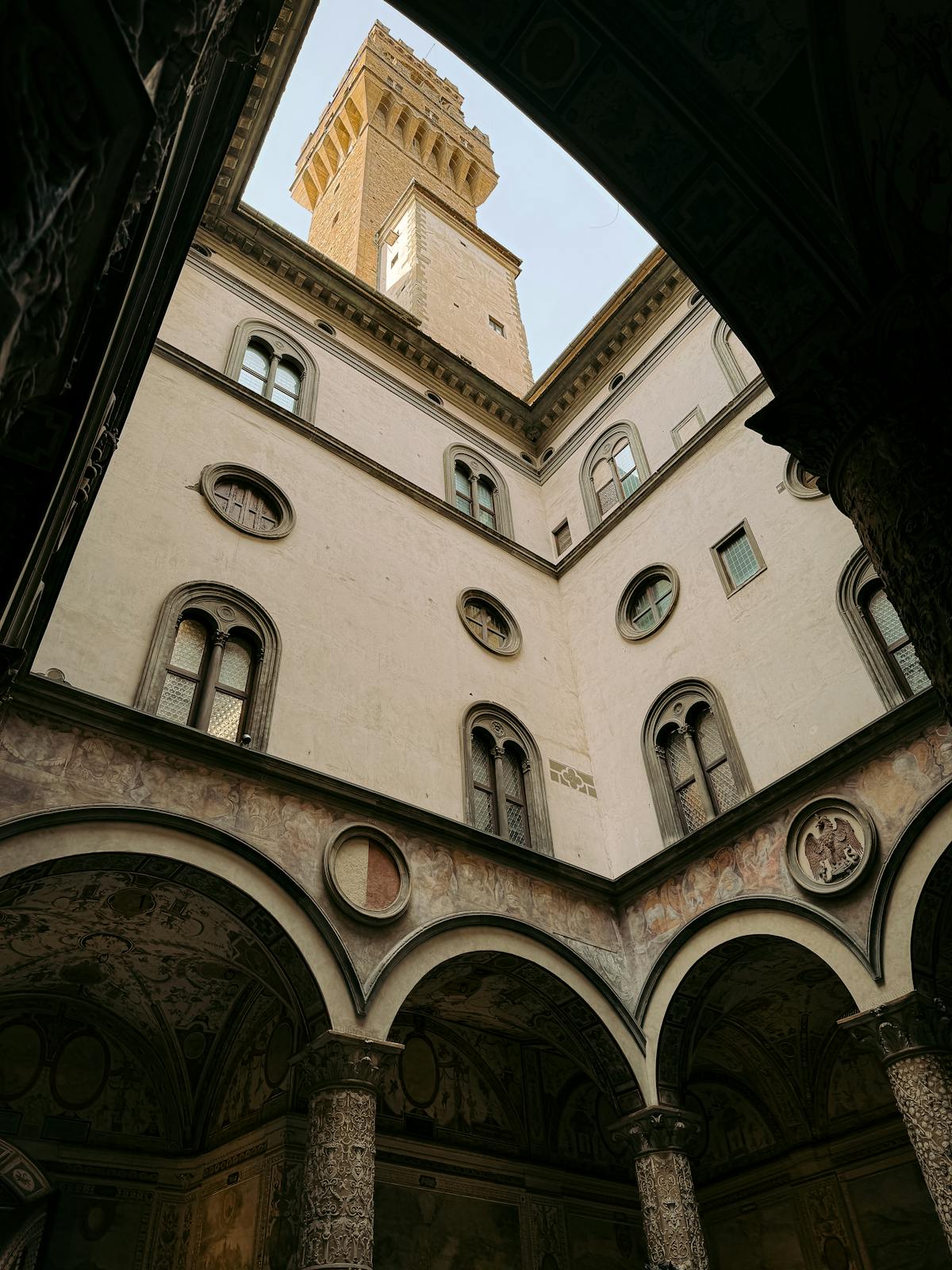 Looking up at the decorated courtyard ceiling in Palazzo Vecchio Florence