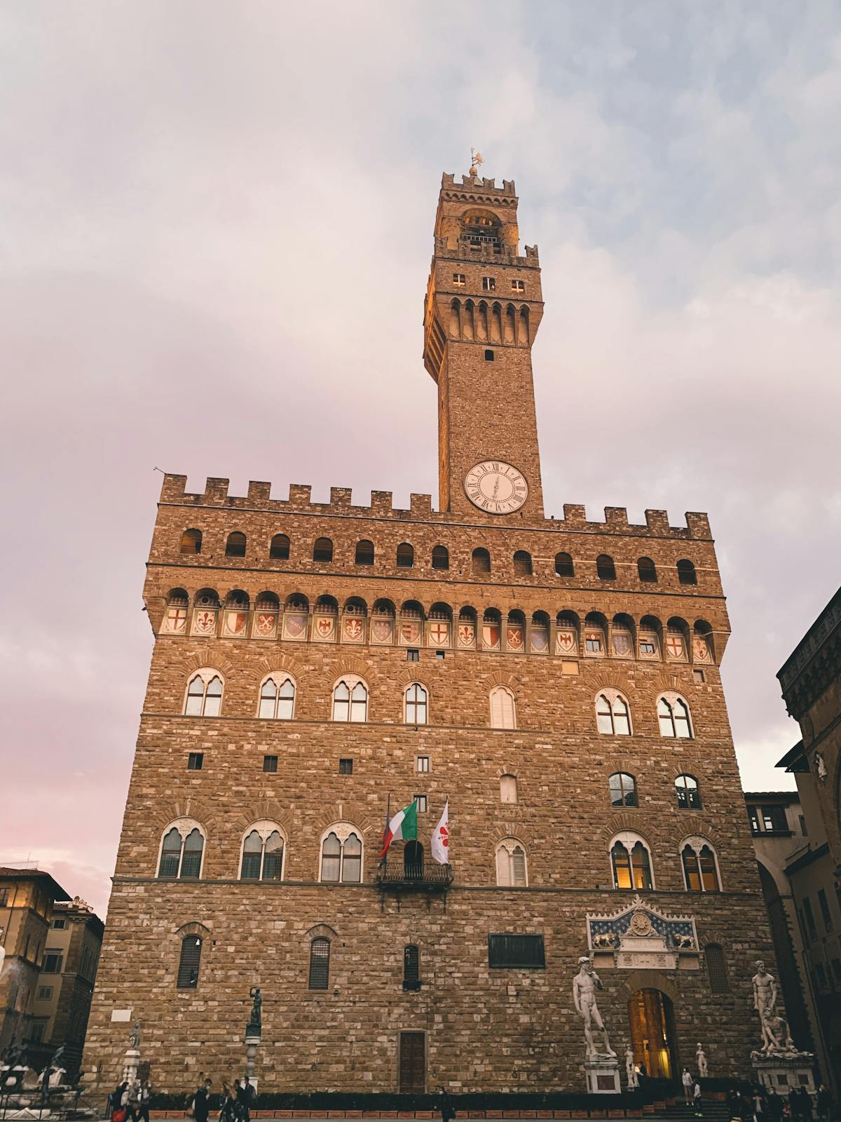 Palazzo Vecchio in Florence during golden hour showing its Gothic architecture