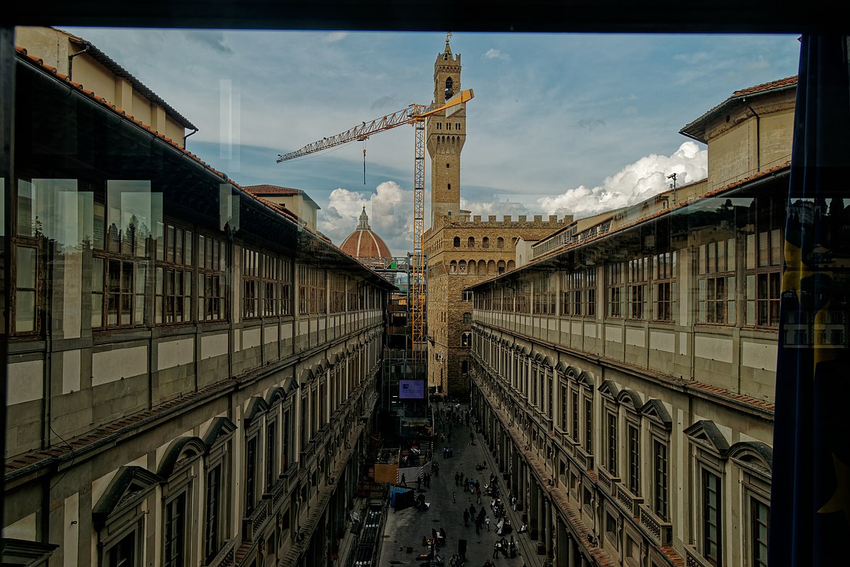View through the Uffizi Courtyard toward Palazzo Vecchio showing the Vasari Corridor