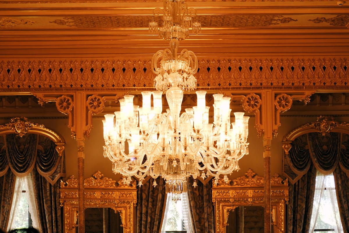 Gold-accented palace interior with crystal chandelier in Istanbul
